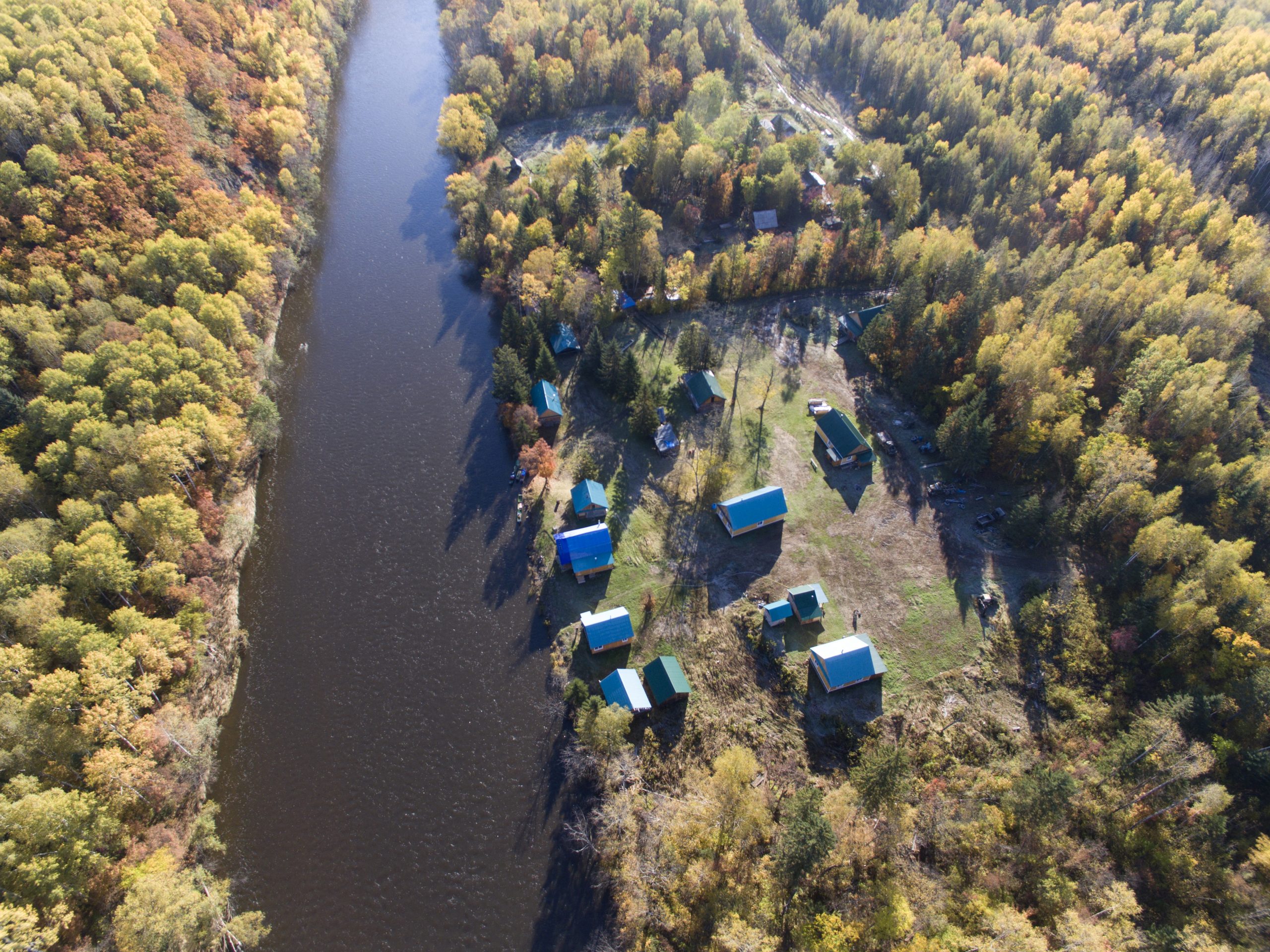 aerial shot of village next to river