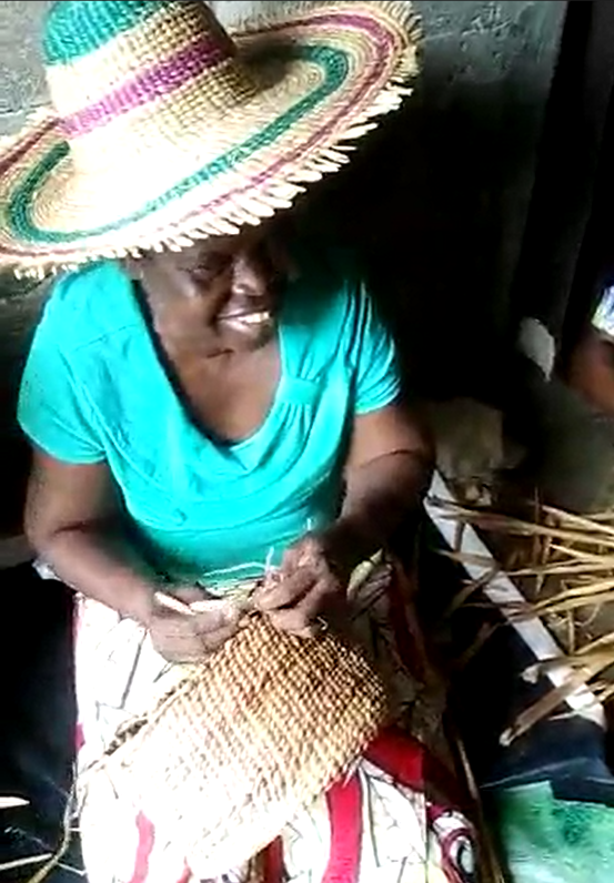 woman weaving water hyacinth